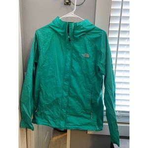 Green north face rain coat